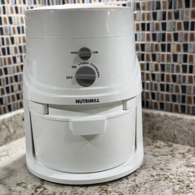 NutriMill Classic Grain Mill sitting on a kitchen counter, ready for grinding fresh flour