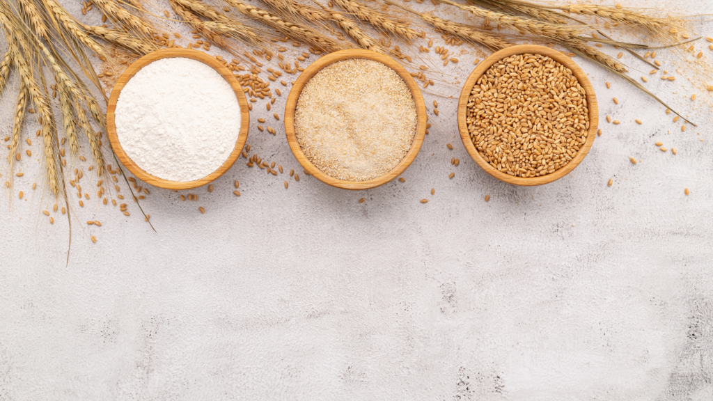 Side-by-side comparison of freshly ground whole wheat flour and store-bought white flour, showing the difference in color, texture, and nutrients.